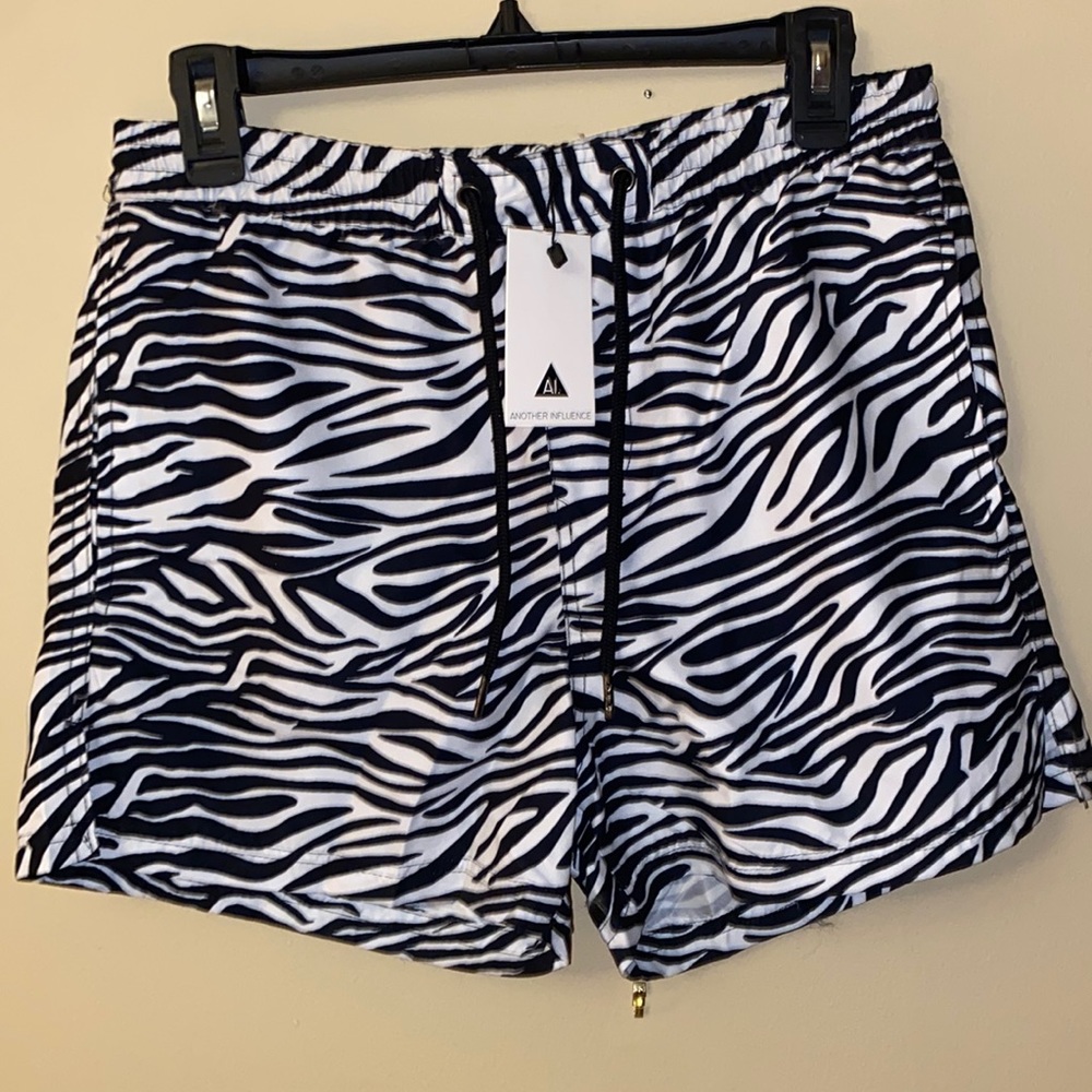 ASOS* Another Influence zebra swim shorts, side pockets and one back pocket.